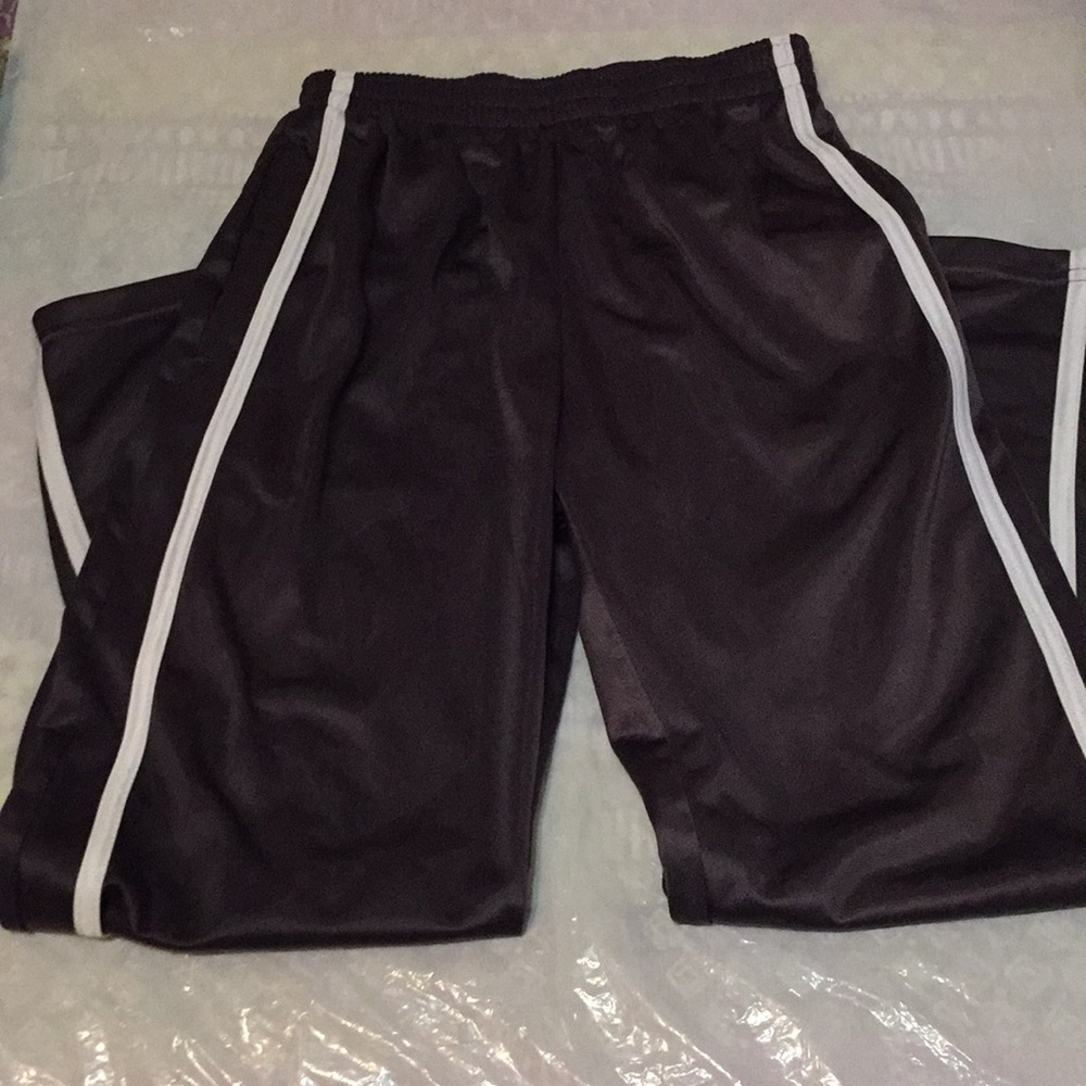 Black sweats with a white line on the side